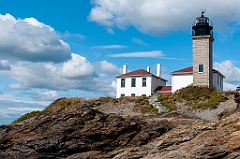 Beavertail Lighthouse Over Jagged Rocks in Rhode Island